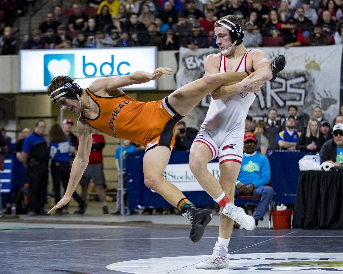 Brendan Barnes of Flathead and Leif Schroeder of Bozeman wrestle in the Class AA 138-pound championship match during the state wrestling tournament at First Interstate Arena in Billings on Saturday.  (Mike Clark/Billings Gazette)