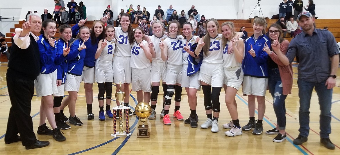 Courtesy photo
The North Idaho Christian Royals won their second straight Mountain Christian League girls basketball tournament championship on Saturday, and ninth in the past 15 years. In addition they also were the 2020 MCL regular season champions, receiving a gold ball trophy which will be on display at the school for a year. From left are coach Jerry Bittner, Maddie Daigle, Christina Connelly, Mary Thomas, Trinity Knight, Danica Kelly, Imelda Bresee, Abi Newman, Courtney Monaghan, Grace Gwin, Symone Pilgrim, Riley Anderson, Kate Malinauskas, Heidi Williams, Hailey LePard and assistant coach Aaron Gwin.