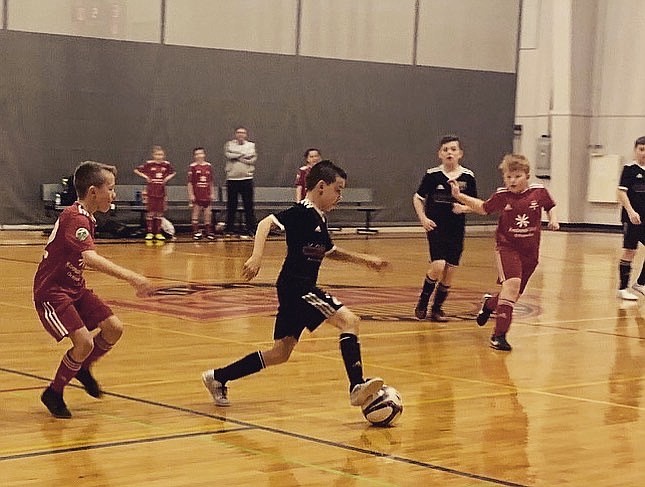 Courtesy photo
Braden Smith of FC North Idaho takes on a 2v1 to score the second of his three goals in a 10-1 victory over the Timbers North on Friday night at the HUB Sports Center in Liberty Lake.