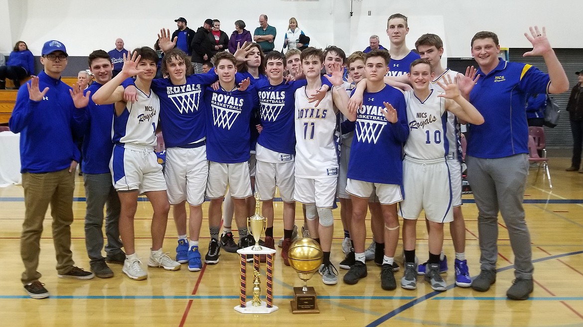 Courtesy photo
The North Idaho Christian boys basketball team won its fifth straight Mountain Christian League tournament championship on Saturday. Also on display in the picture is the gold ball that is awarded for winning the league championship which the Royals won for the fifth straight season. From left are assistant coach Auston Henry, assistant coach Cross Pilgrim, Cruz Alliano, James Kelly, Phillip Connelly, Mason Crabtree, Josiah Desrochers, Kessler Johnson, Jakob Peterson, Wyley Pilgrim, Ben Lowman, Jack Hill, Malachi Bullington, Joe Anderson, Bryce Koontz and coach Shawn Thompson.