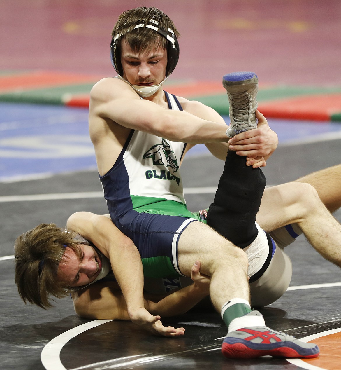 Glacier's Lance Fretwell wrestles Billings Skyview's Caleb Partridge in a Class AA 132-pound match in the first round of the state wrestling tournament at First Interstate Arena on Friday.  (Casey Page/Billings Gazette)