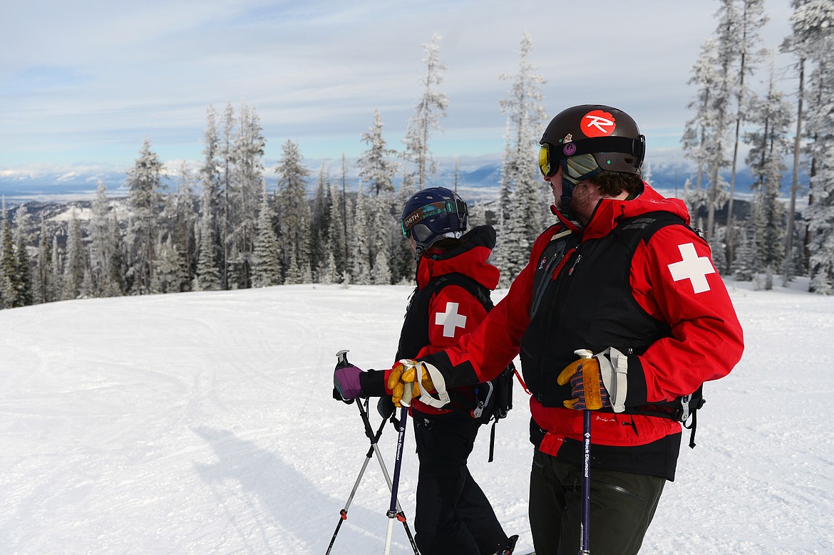 A men in protective sportswear riding snowmobile Branas Ski Resort