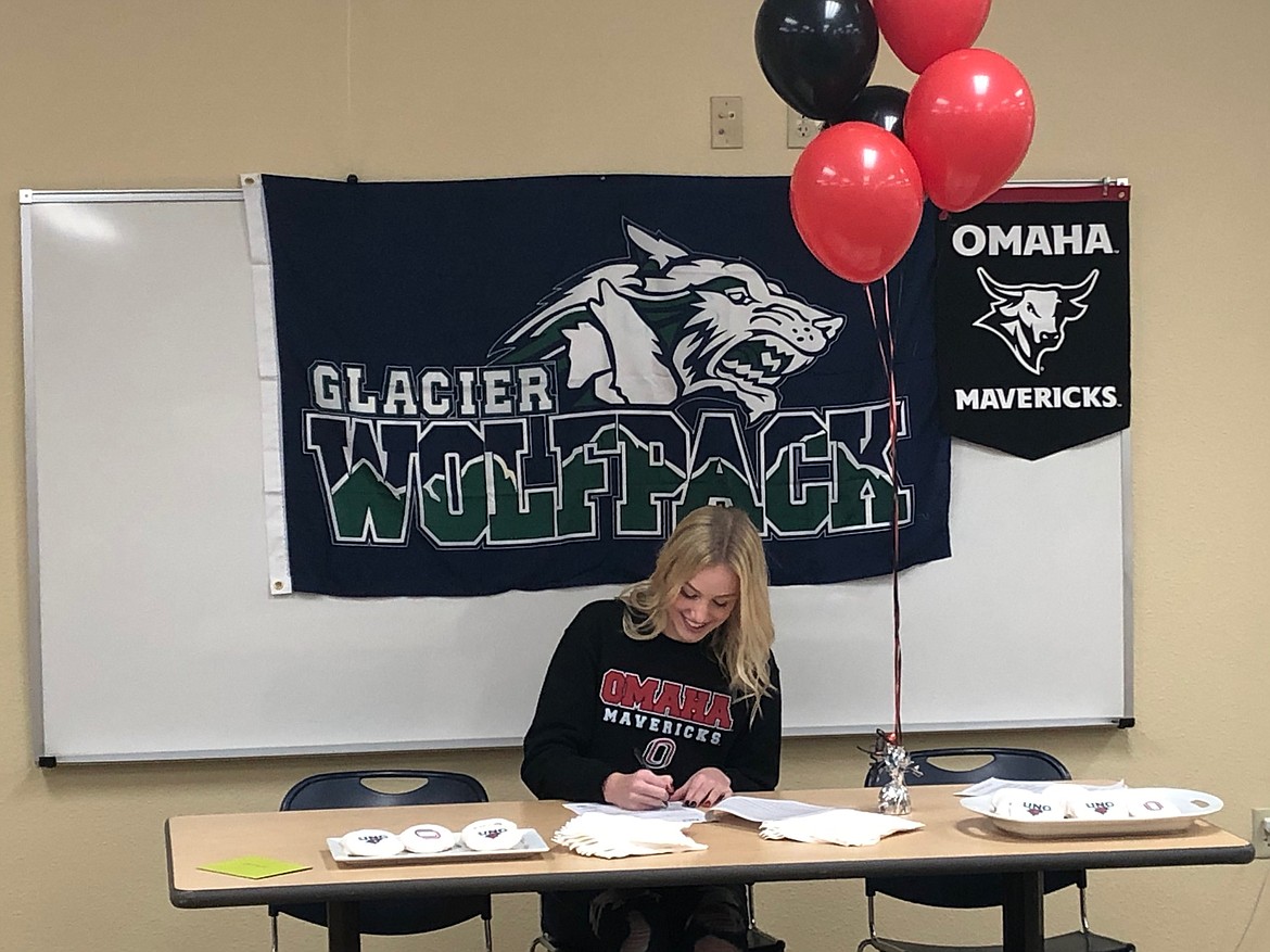 Glacier senior Caroline Dye signs a letter of intent for swimming at the University of Nebraska-Omaha on Nov. 13, 2019. Dye is the first-ever Montana commit in the school's history. (Photo courtesy Mark Dennehy/Glacier High School)