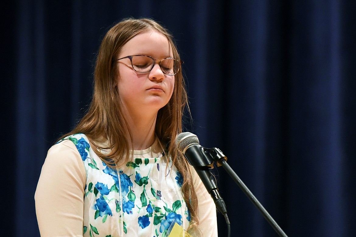 Abigail Rye, from Flathead Home Educators Association, closes her eyes before spelling the word &#147;garment&#148; at the 2020 Flathead County Spelling Bee.