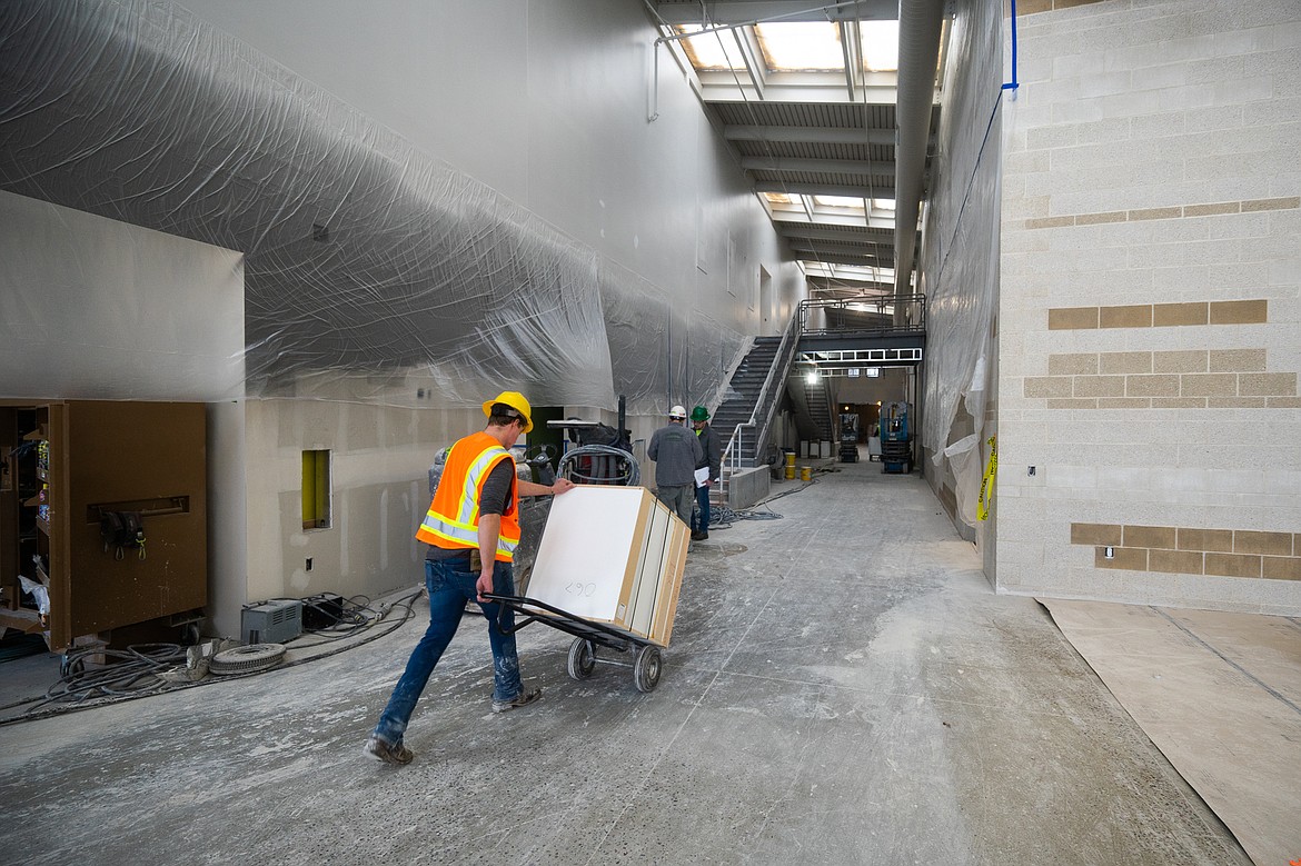 Construction workers haul in equipment as the new Muldown Elementary School begins to come together. (Daniel McKay/Whitefish Pilot)