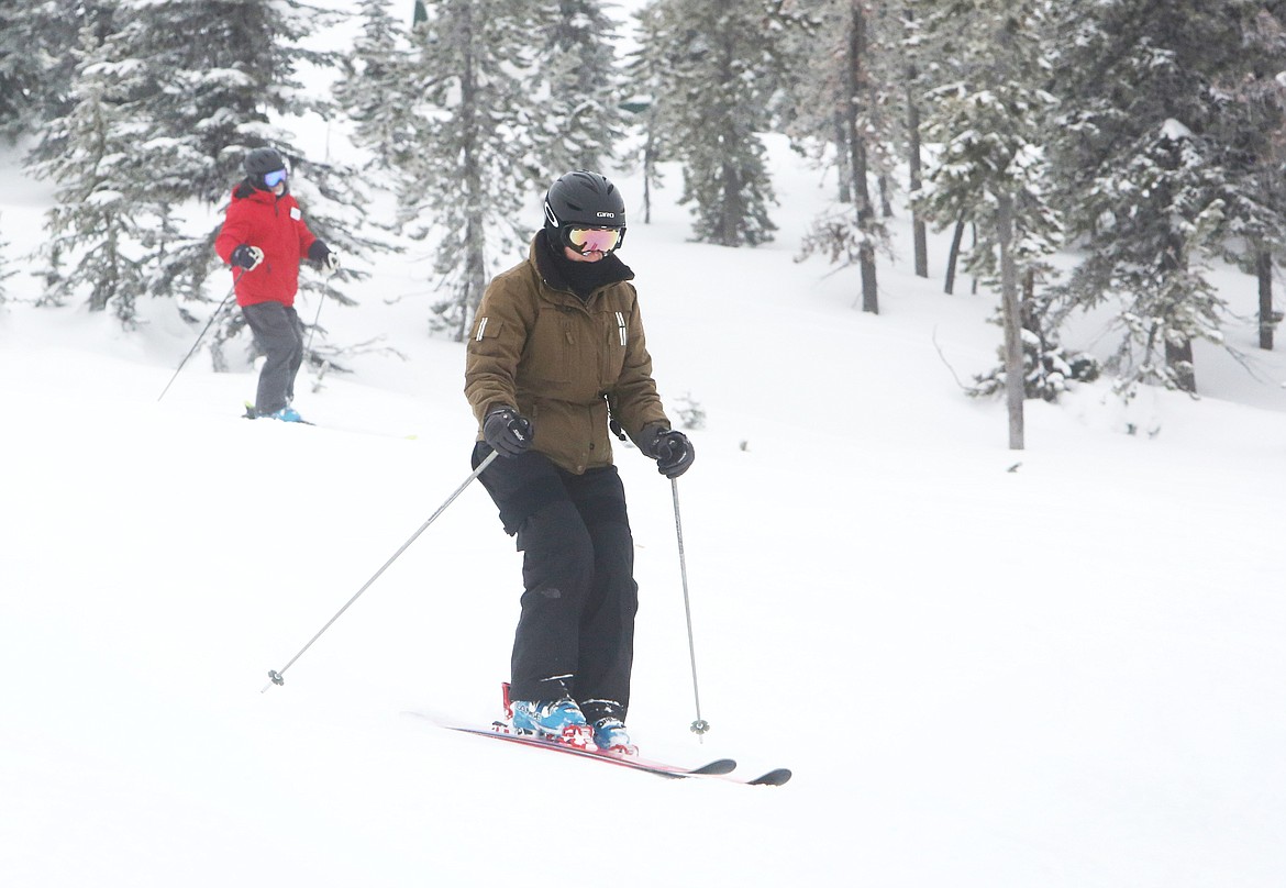 Diane Edge, of Bigfork, skis gracefully down Emmons Ridge on Blacktail Mountain with a crew of fellow experienced skiers. (Mackenzie Reiss/Daily Inter Lake)