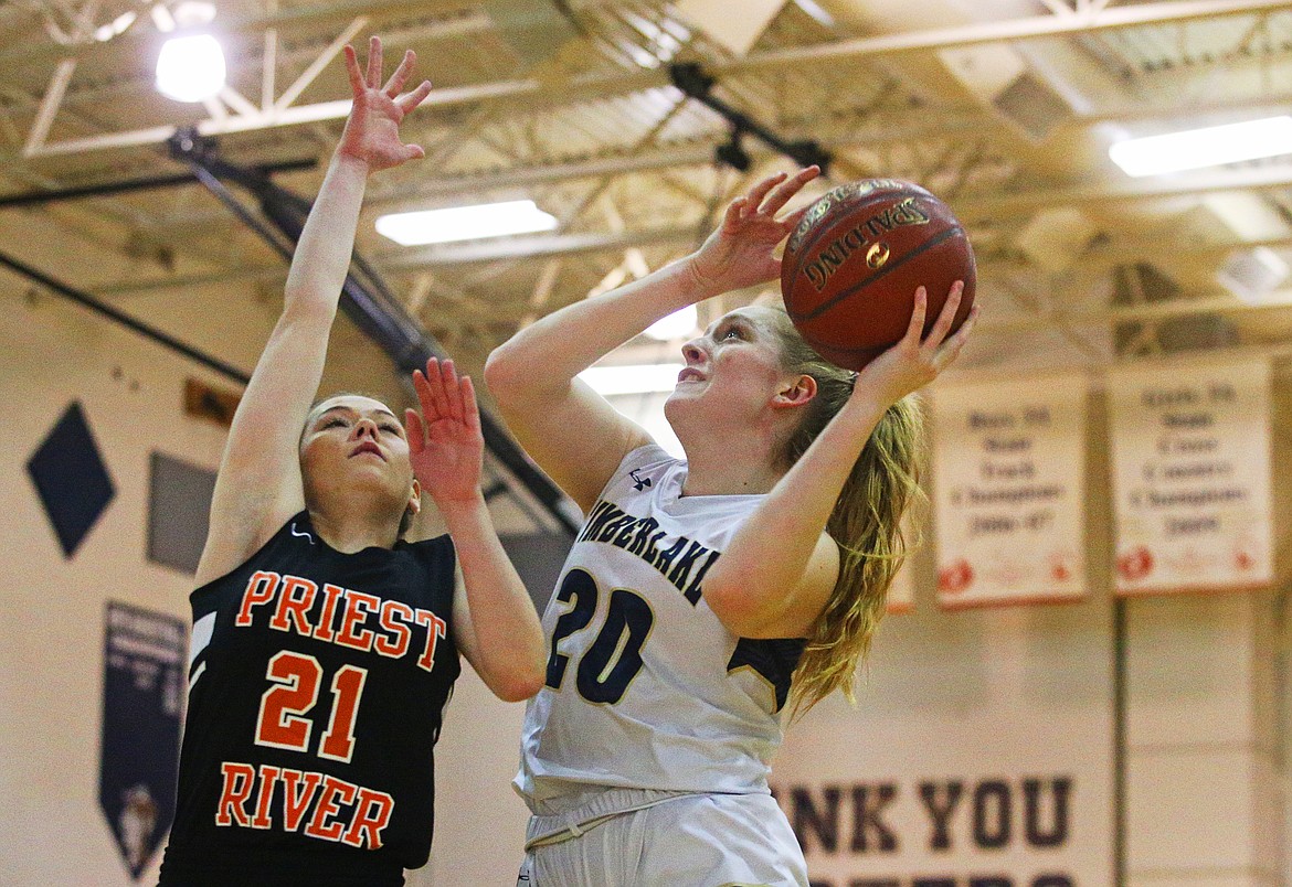 Photos: LOREN BENOIT/Press 
Timberlake High&#146;s Brooke Jessen drives toward the basket while defended by Priest River&#146;s Hannah Palfrey during Monday&#146;s game at Timberlake High School. Jessen scored her 1,000th career point during the Tigers&#146; 75-20 victory in their 3A District 1 opener.