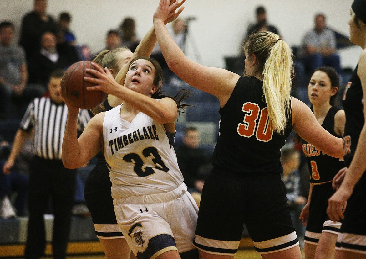 Timberlake&#146;s Kati Bain drives to the basket around Priest River defenders during Monday&#146;s game at Timberlake High School.