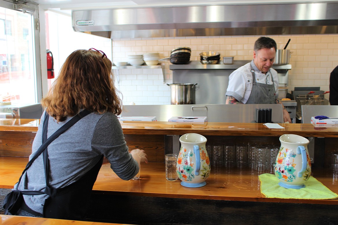 Photo by CHANSE WATSON
Luanne and Rob in the cafe kitchen talk about customer orders on Saturday.