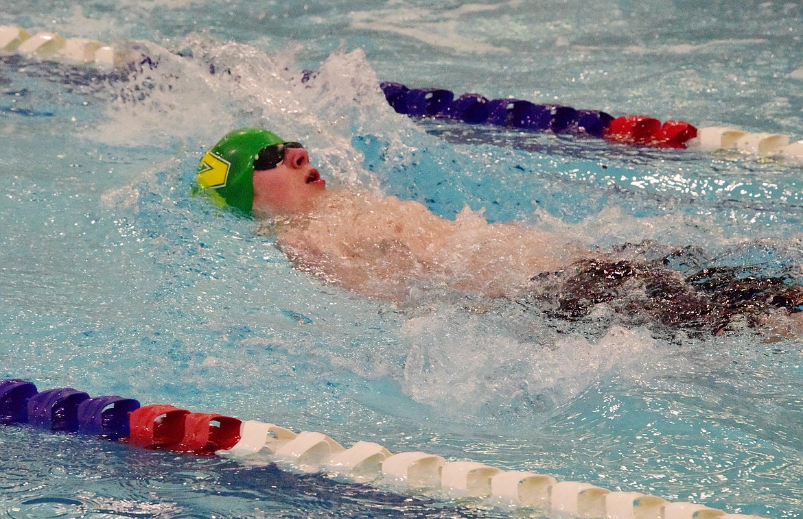 Bulldog Aaron Dicks swims in the 100 backstroke last weekend at the All-Class State Tournament in Great Falls. (Photo courtesy Corey Botner)