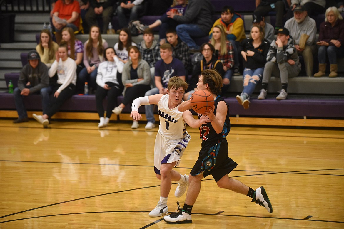 Charlo&#146;s Tucker Love (1) tries to steal the ball from Two Eagle River&#146;s Anthony Charlo during Friday&#146;s game. (Scott Shindledecker/Lake County Leader)