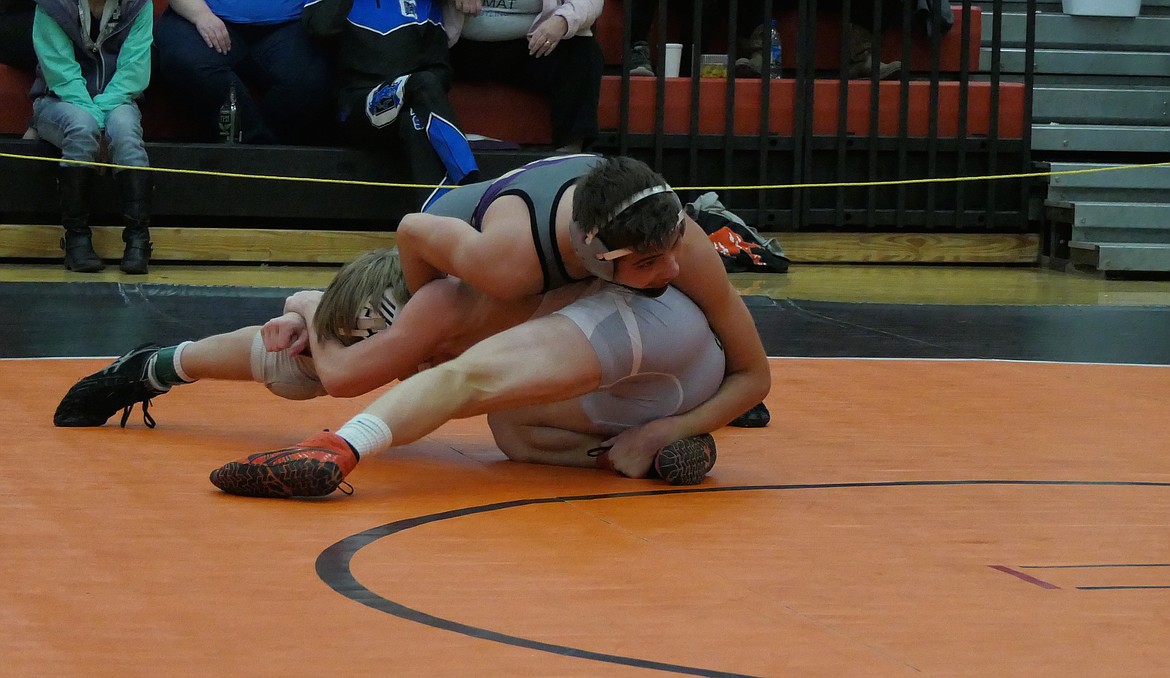 Polson&#146;s Maysn Cowell wrestles Elijah Warner of Frenchtown in 120 pound finals at the Western Class A Divisional Tournament last weekend.(Whitney England/Lake County Leader)