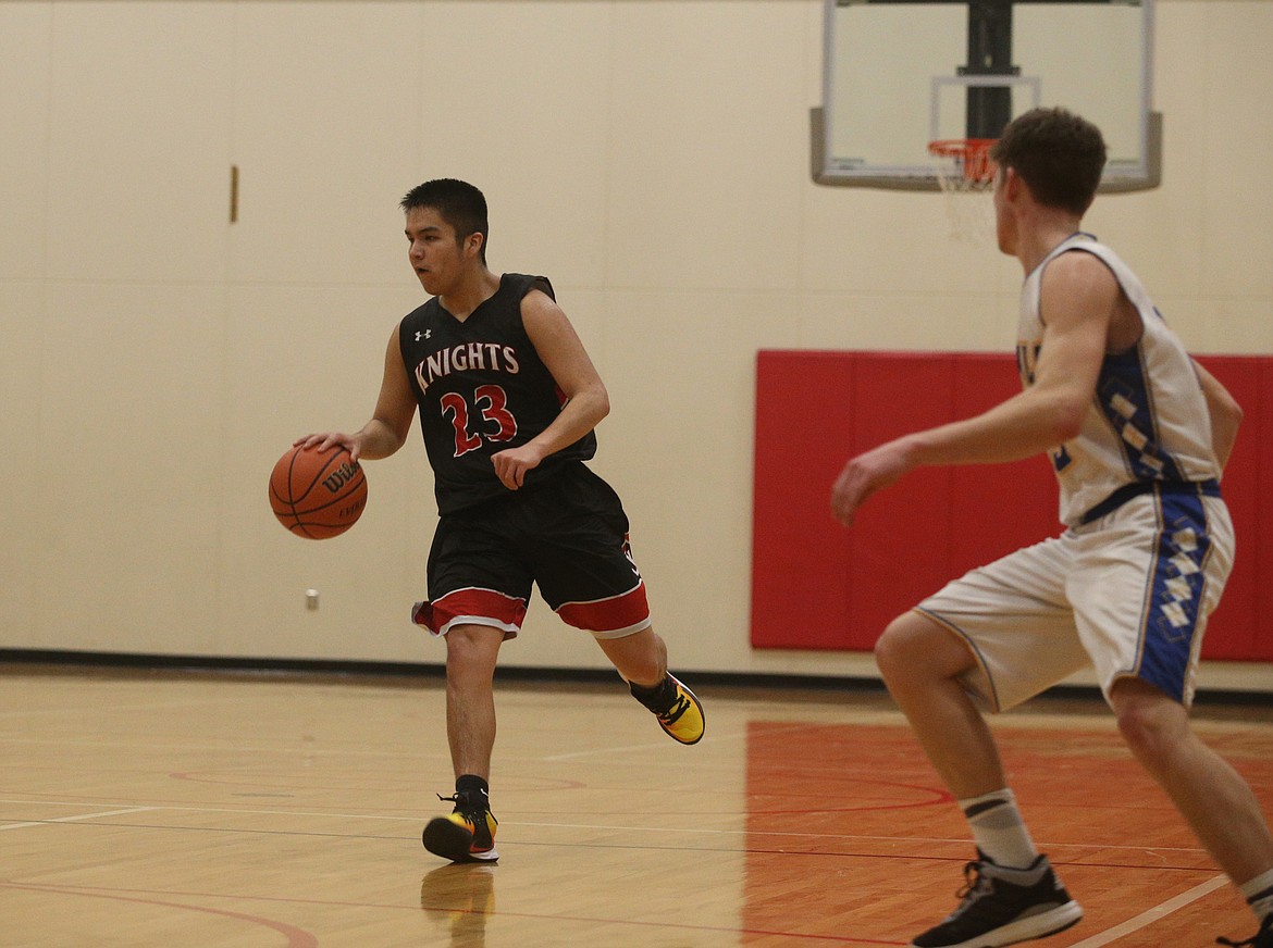 Lakeside&#146;s Talon Twoteeth dribbles the ball down the court against North Idaho Christian School.