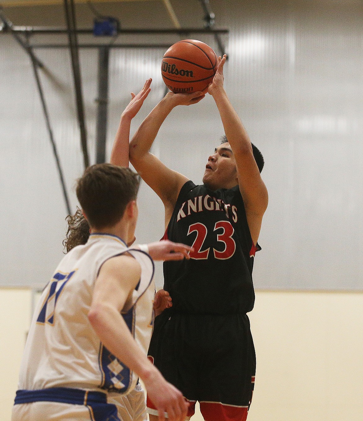 Lakeside&#146;s Talon Twoteeth shoots a deep two over North Idaho Christian defenders.