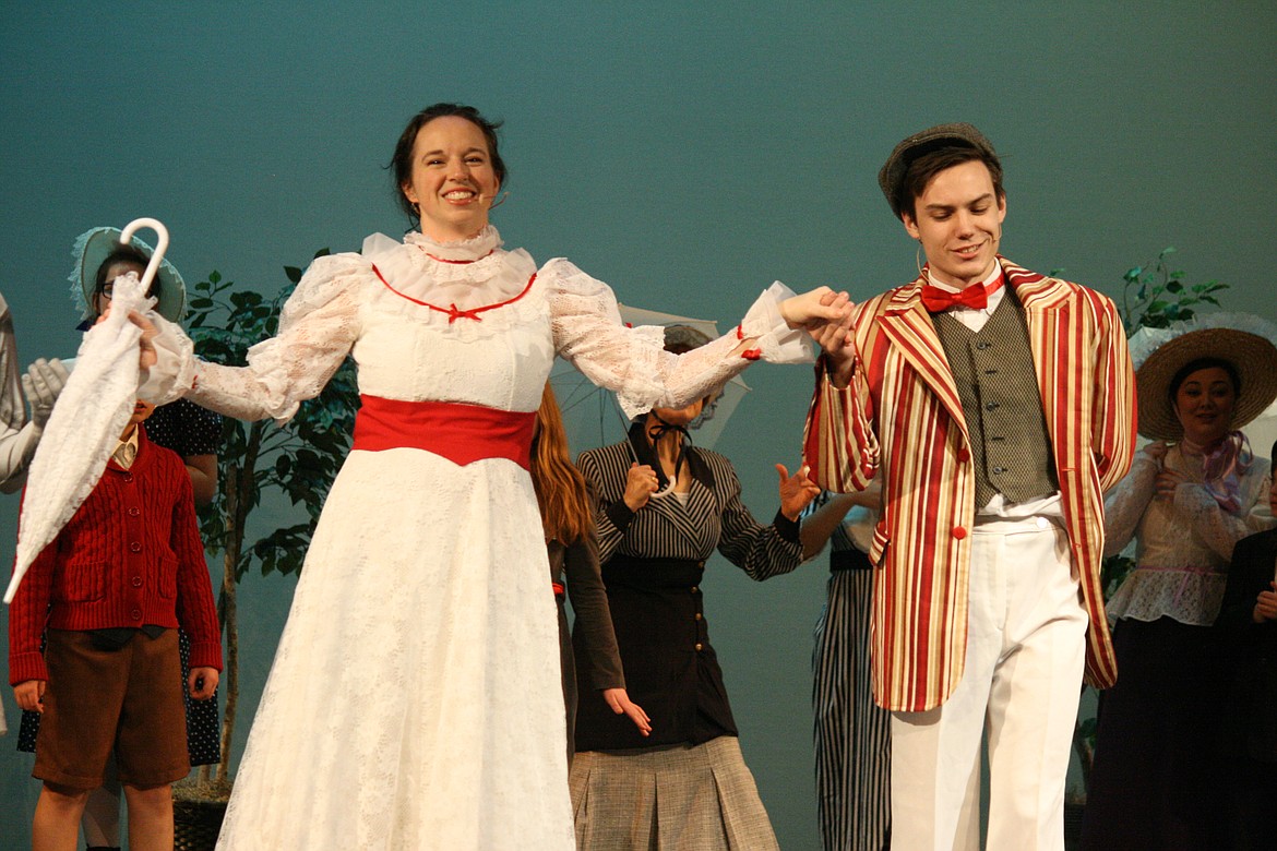 Cheryl Schweizer/Columbia Basin Herald | Mary Poppins(Stephanie Moore, left) and Bert (Taylor Street) turn Hyde Park into a magical place in the Quincy Valley Allied Arts production of &#145;Mary Poppins.&#148;