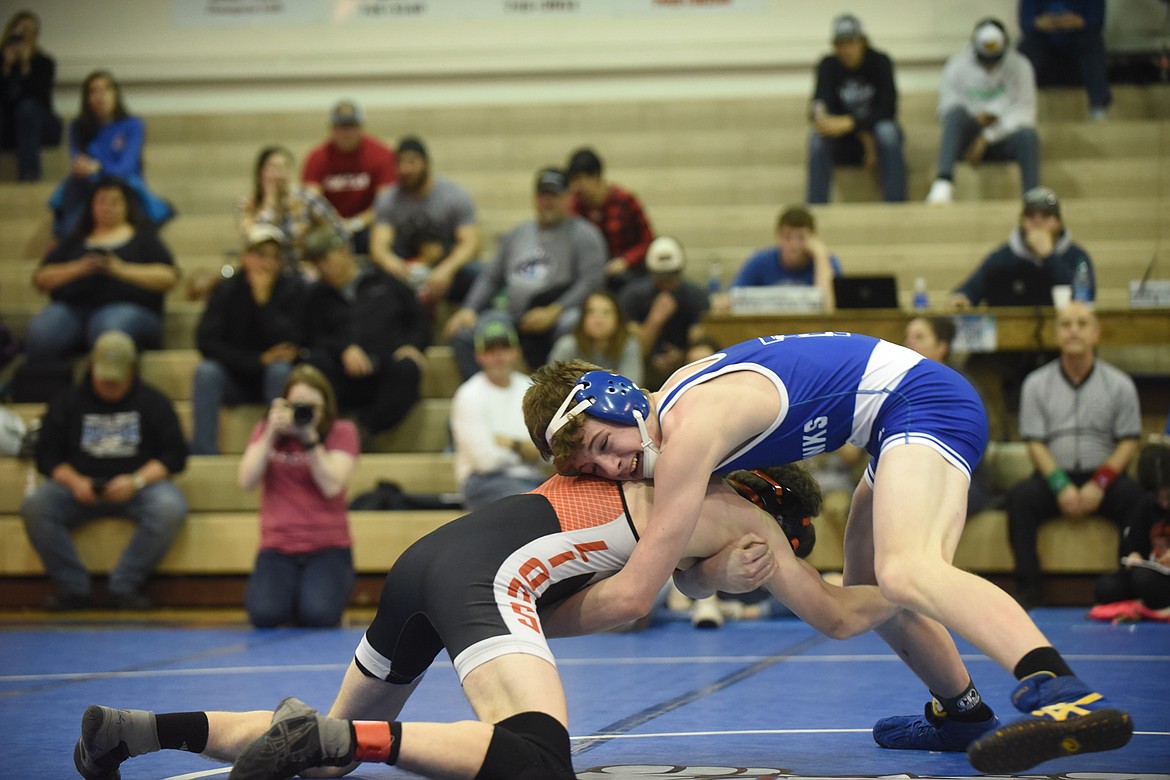 Thompson Falls 132-pounder Elijah Ratliff battles Eureka&#146;s Gunnar Smith during their match Saturday at the Class B-C Divisional Tournament in St. Ignatius. (Scott Shindledecker/Valley Press)