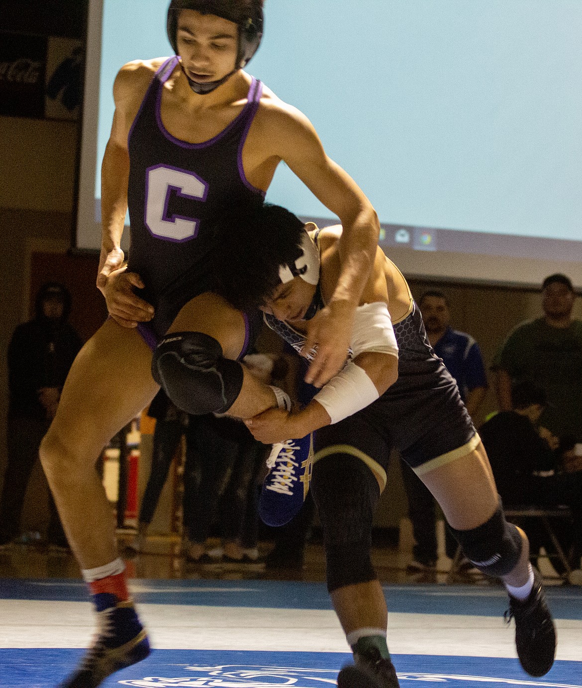 Casey McCarthy/The Sun Tribune 
Royals Yahir Morales (right) looks to take Abel Morales of Connell to the ground in their bout in the 126 championship on Saturday afternoon.