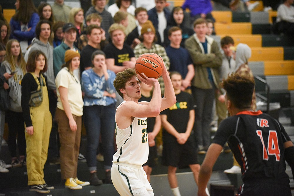 Justin Conklin launches a three during the Bulldogs' home loss last Tuesday. (Daniel McKay/Whitefish Pilot)