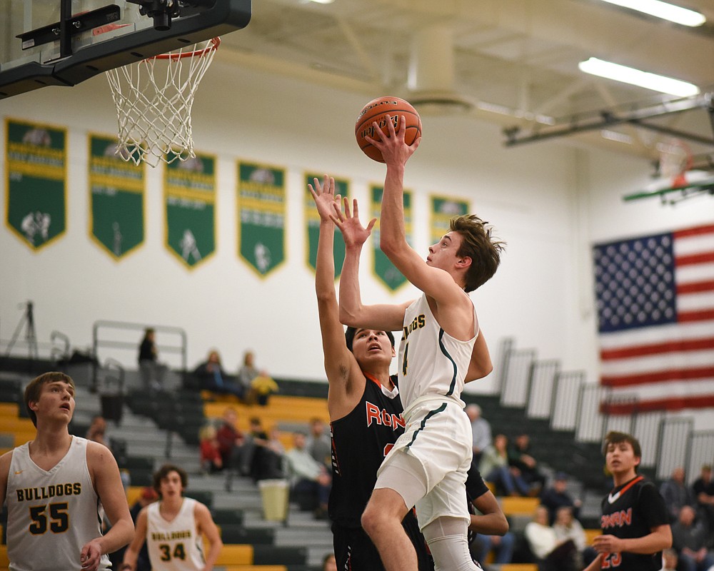 Bodie Smith rises for the layup during the Bulldogs' home loss last Tuesday. (Daniel McKay/Whitefish Pilot)