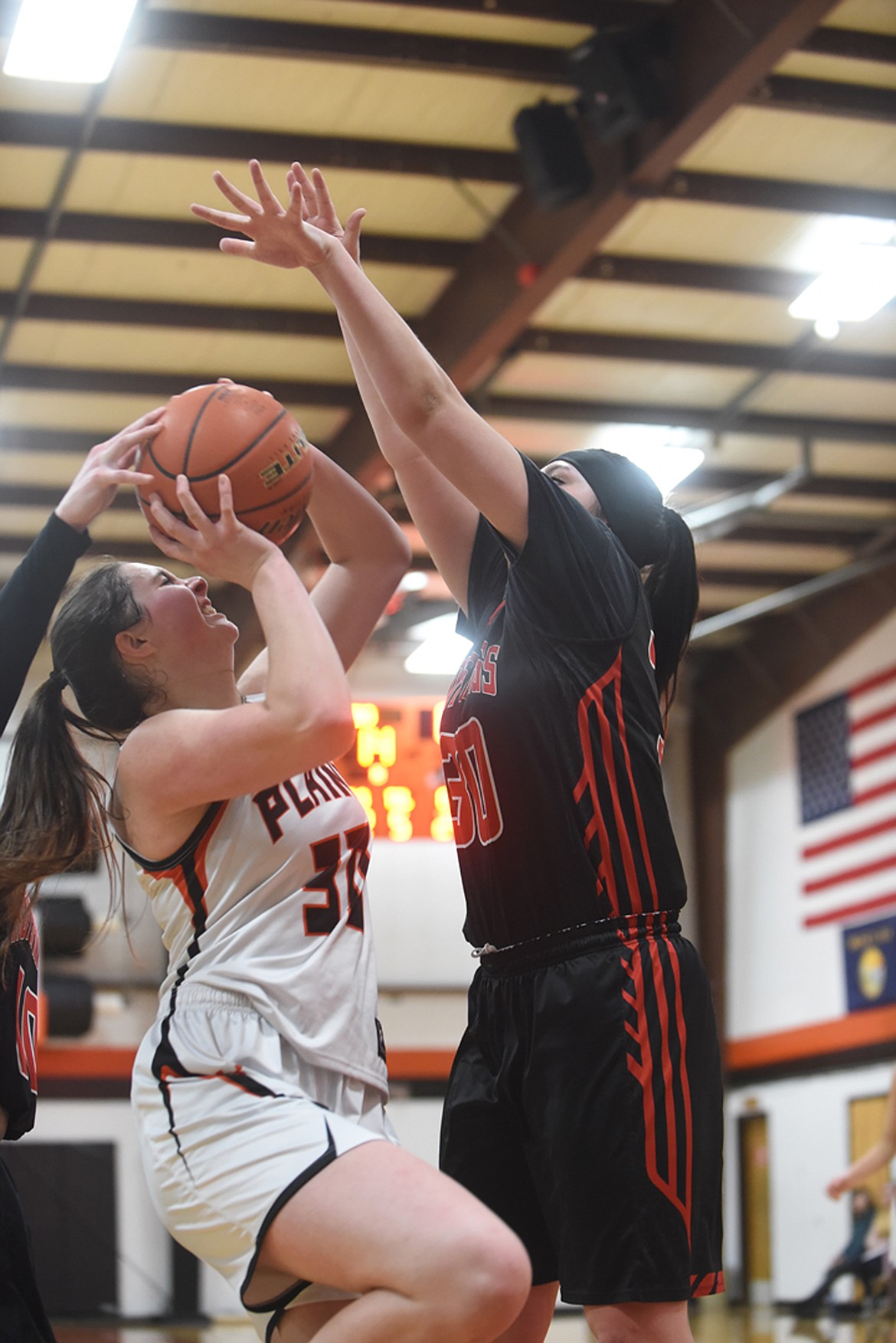 Plains senior Kylee Altmiller meets resistance from Hot Springs McKennzie Cannon during their game Feb. 6. Altmiller scored 15 while Cannon tallied 19 to help her team beat the Trotters, 69-50. (Scott Shindledecker/Valley Press)