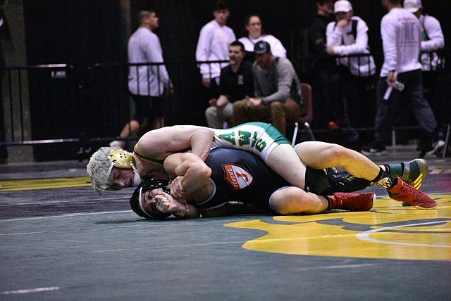 MOLLY MASON/Special to The Press
Alex Edelblute, top, of Lakeland, beat Eli Espino of Jerome 3-1 in their state 4A 126-pound quarterfinal match Friday at the Ford Idaho Center in Nampa.