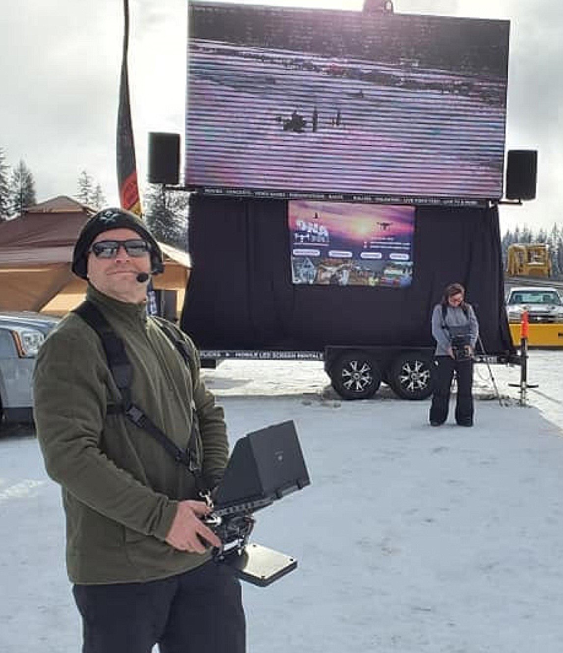 Don Taylor (left) keeps track of his drone while filming the Priest Lake Vintage Snowmobile races in January, while his wife Adina pilots hers from their basecamp. The husband-and-wife team out of Hayden launched their newest business &#151; a film production company called DNA Drone Applications &#151; in January. (Courtesy of Adina Taylor)