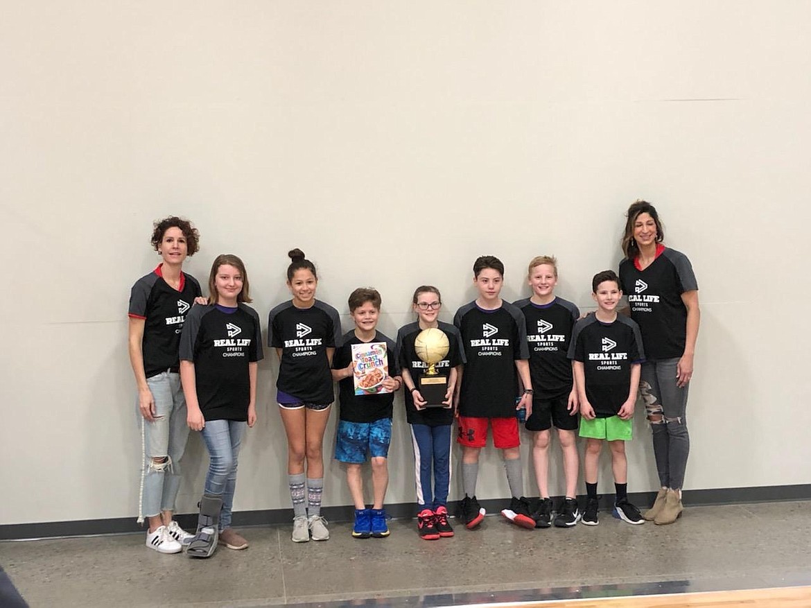 Courtesy photo
The Purple Dragons won the 5th/6th-grade championship in the Real Life Ministries basketball league. From left are coach Joey Blood, Jenna Patterson, Lucy Love, Sawyer Bateman, Zavannah Traxtle, Marcus Hughes, Cale Blood, Waylon Hinderager and coach Emily Love.