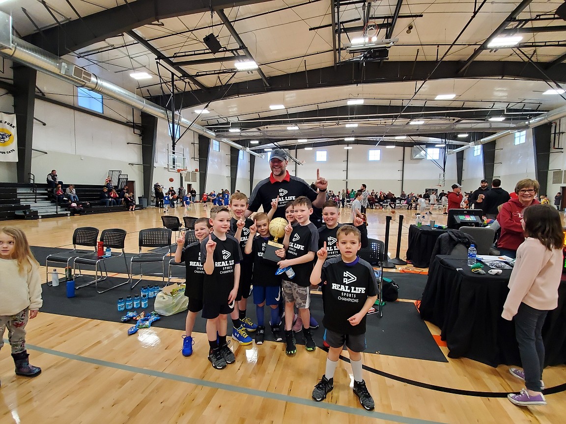 Courtesy photo
The Huskies won the 1st/2nd-grade championship in the Real Life Ministries basketball league. From left are Jaden Hoffman, Tate Torfin, Bobby Hunter, Palmer Murphy (holding trophy), Avy Murphy (behind trophy), Byron Bertsch, Parker Henninger and Merrick Morse; and rear, coach Will Murphy. Not pictured is coach Jimmy Hoffman.