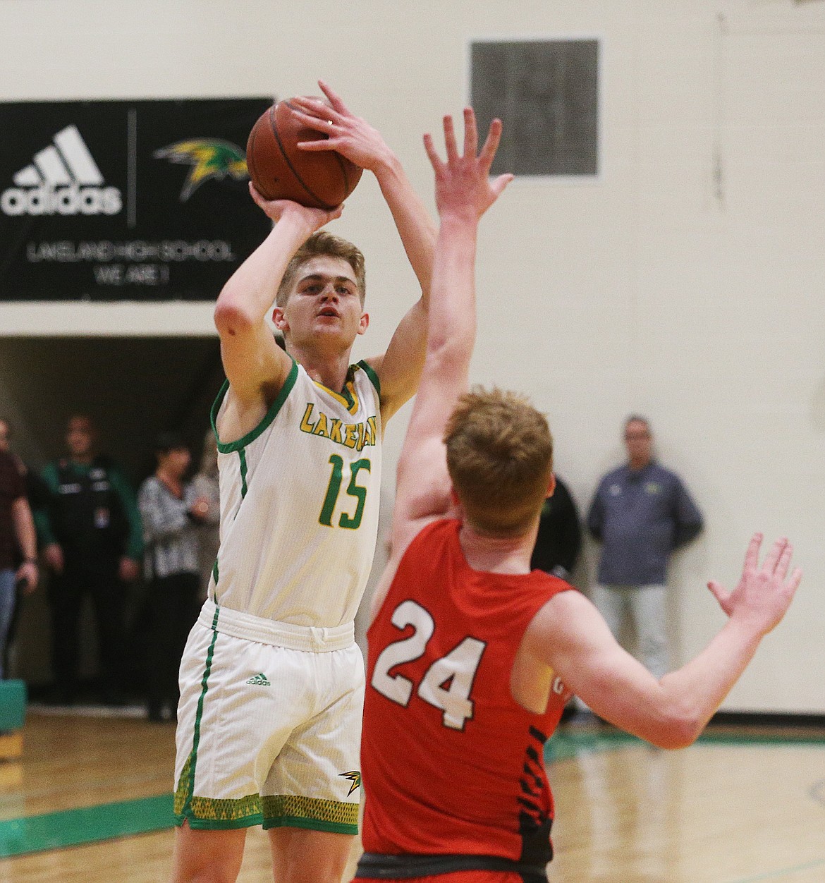 Lakeland High&#146;s Noah Haaland shoots a three pointer in Monday&#146;s game against Sandpoint. (LOREN BENOIT/Press)