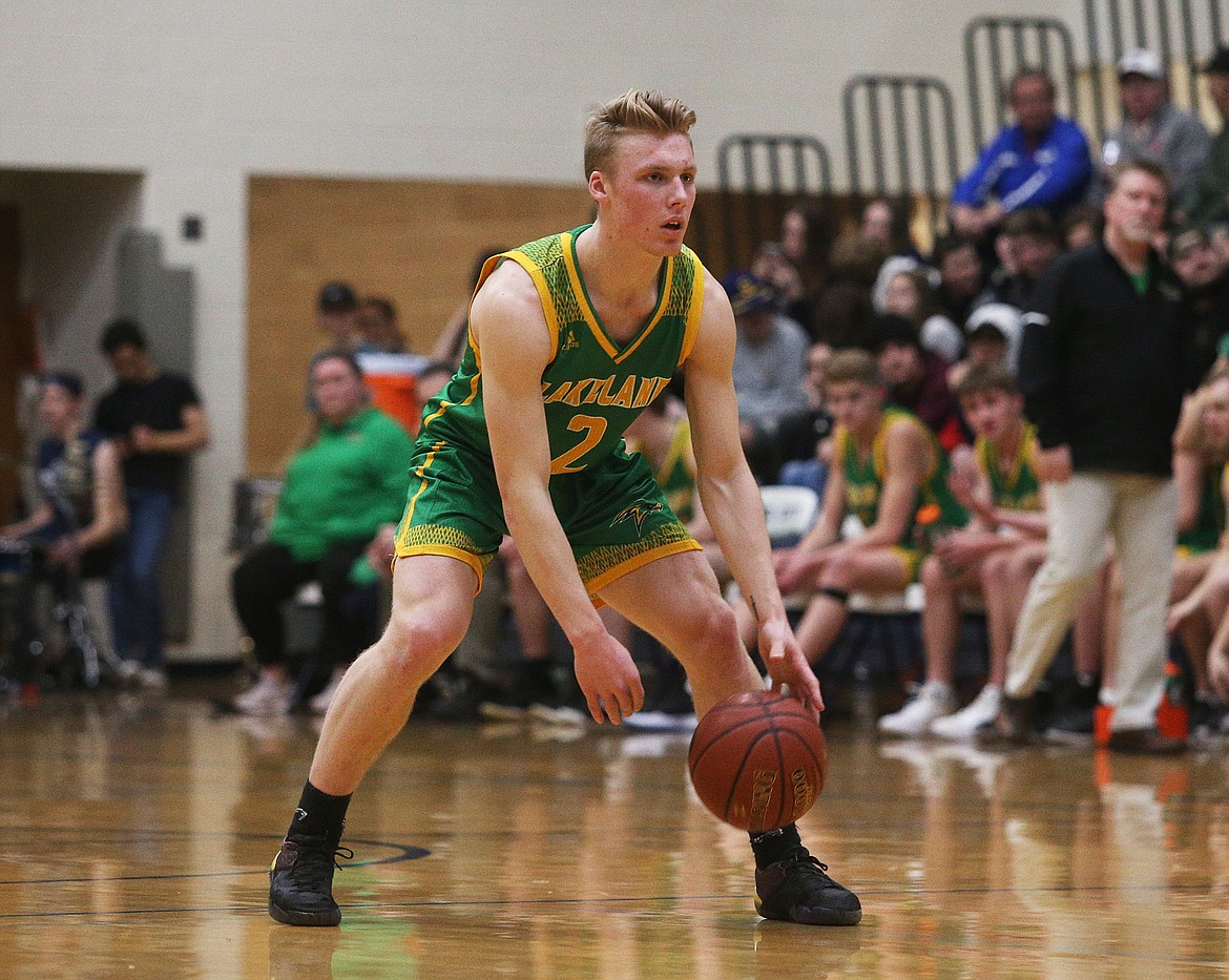 Lakeland&#146;s Ben Zubaly dribbles the ball at the top of the key in a game at Lake City.