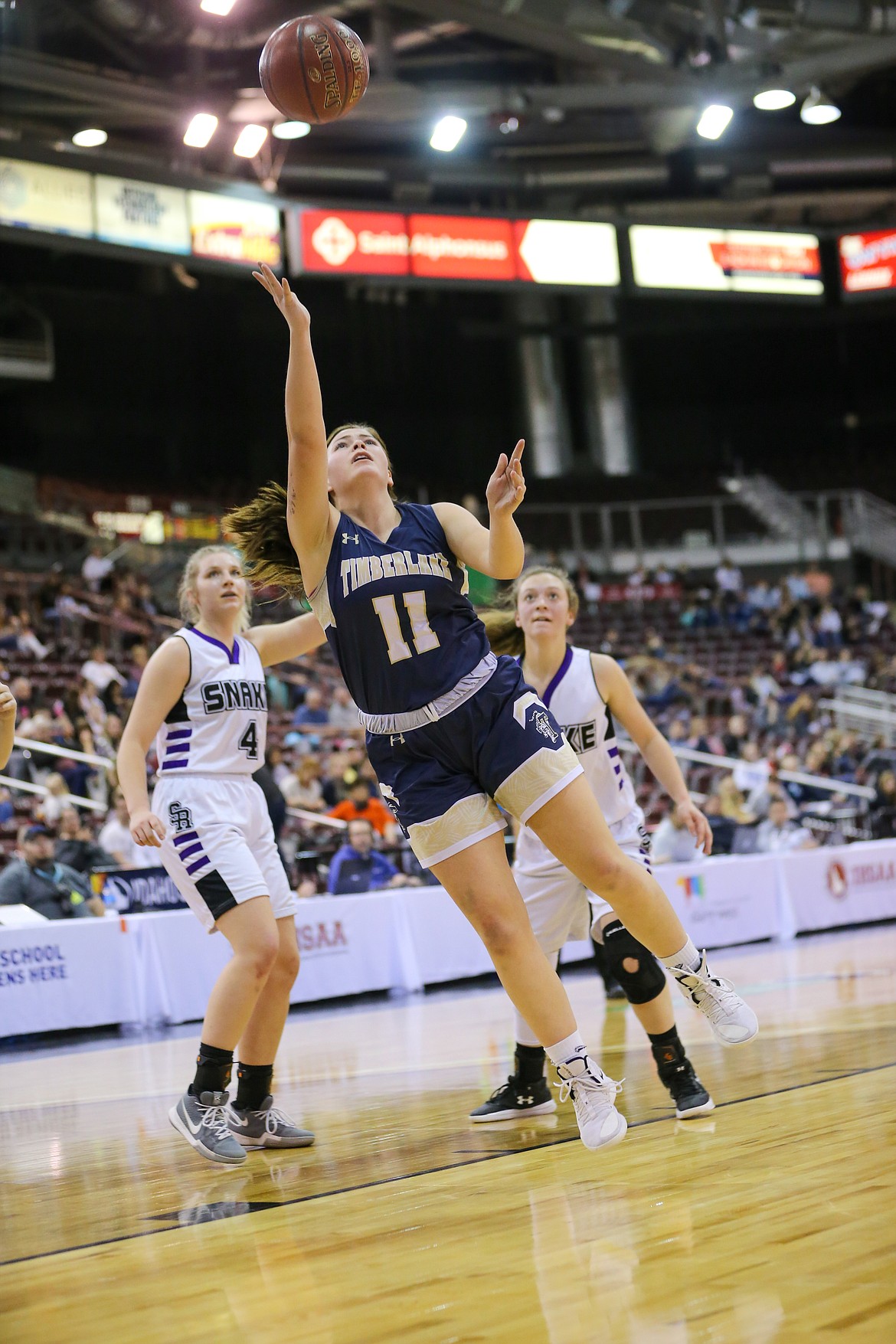 Photo by JASON DUCHOW PHOTOGRAPHY
Bernie Carhart of Timberlake puts up a shot against Snake River in the state 3A girls championship game Saturday at the Ford Idaho Center in Nampa.