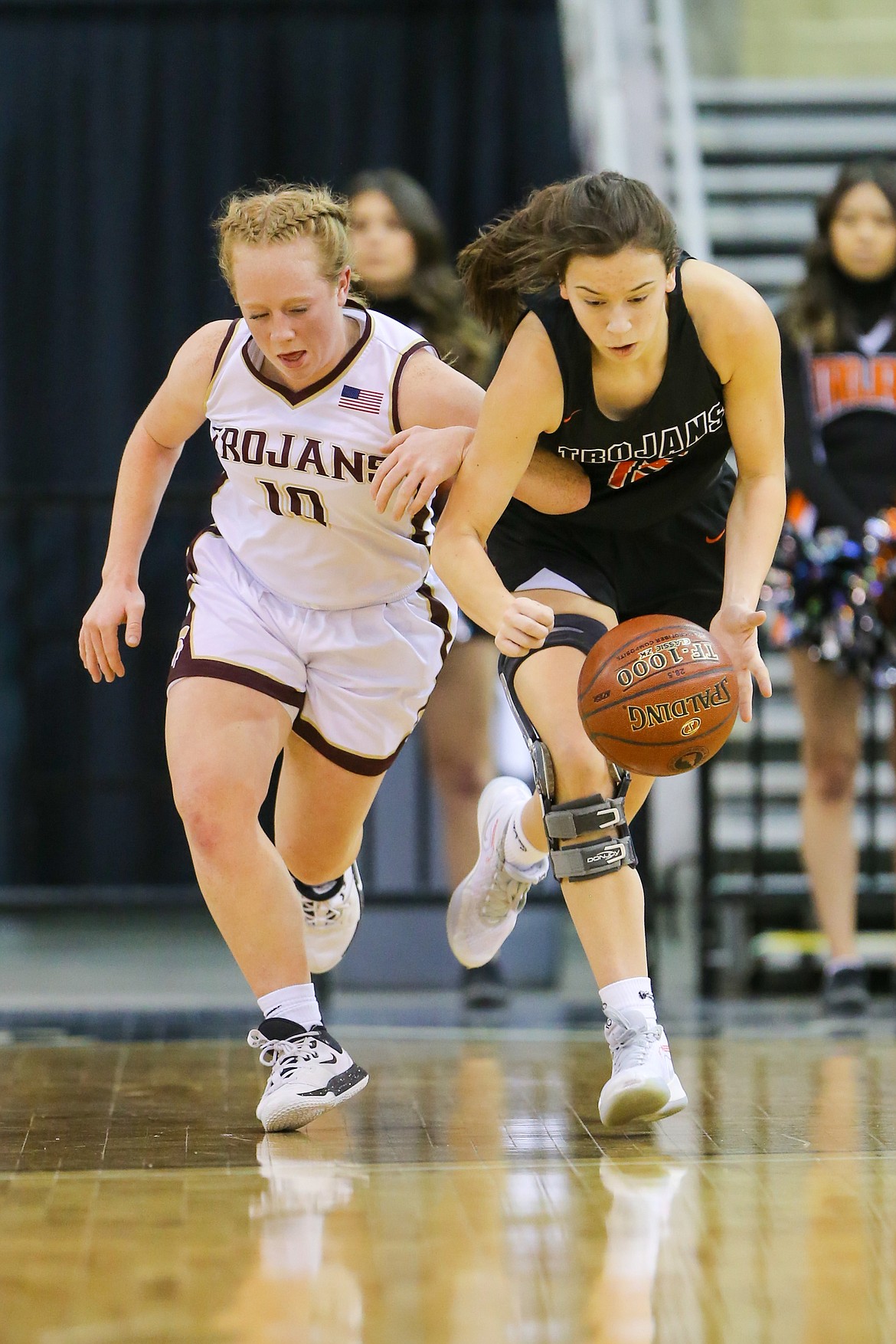 Photo by JASON DUCHOW PHOTOGRAPHY
Katie Fleming, right, of Post Falls, looks to collect the ball as Hallie Boone of Rigby defends Friday in a state 5A girls consolation game at the Ford Idaho Center in Nampa.