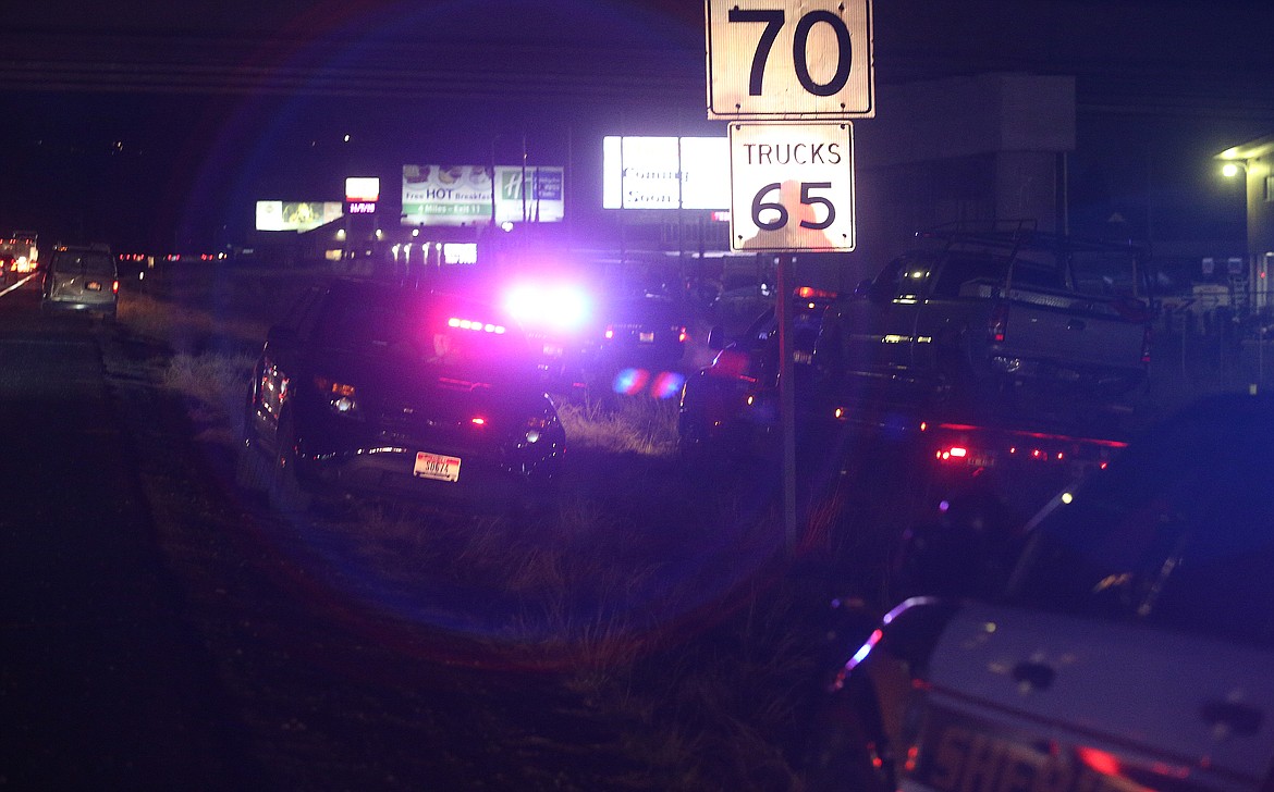 LOREN BENOIT/Press file
Kootenai County Sheriff&#146;s Office deputies work on an accident scene on Nov. 7, 2019, near Greensferry overpass on Interstate 90. Jacob S. Frey, a 37-year-old Newport, Wash., man nearly rammed a police vehicle on Northwest Boulevard and fled from police on Interstate 90 before driving into the median, where he was apprehended with the help of a K-9 unit.