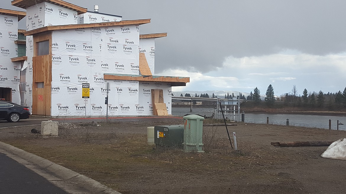 A home under construction on the Spokane River waterfront on Bellerive in Riverstone.