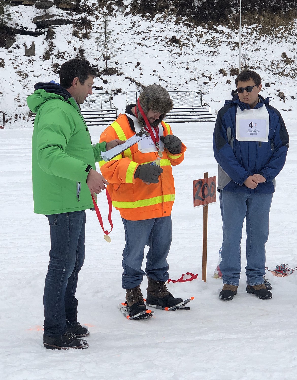 (Photo courtesy of CHRIS PAINTER)
Thomas Dorenkamp receives his three medals at the Winter Games on Feb. 8.