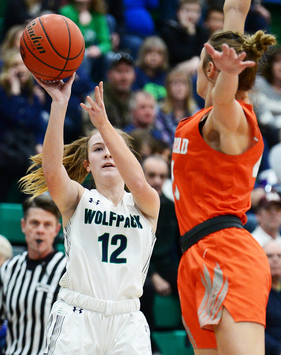 Glacier's Kenzie Williams (12) looks to shoot with Flathead's Clare Converse (15) defending during a crosstown matchup at Glacier High School on Friday. (Casey Kreider/Daily Inter Lake)