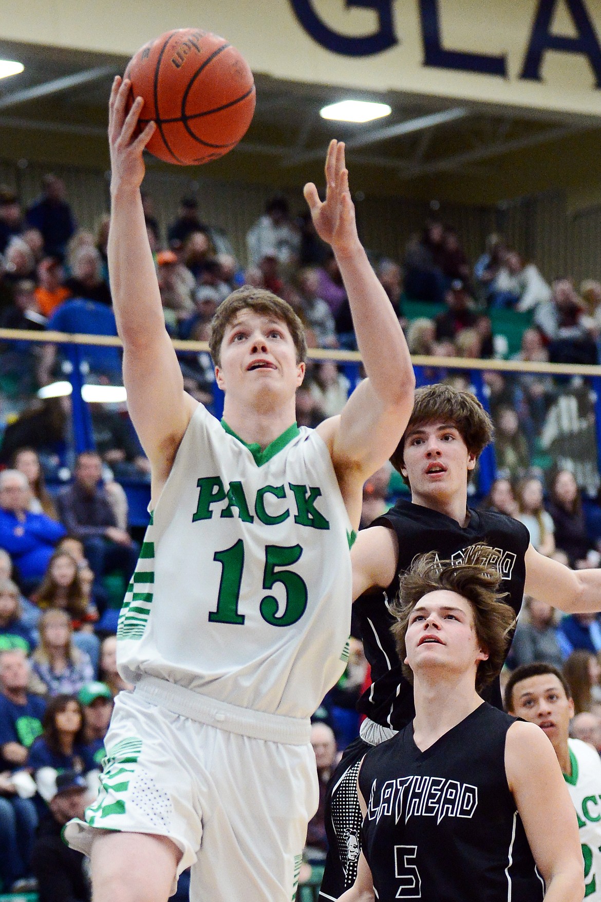 Glacier's Drew Engellant (15) drives to the basket during a crosstown matchup against Flathead at Glacier High School on Friday. (Casey Kreider/Daily Inter Lake)