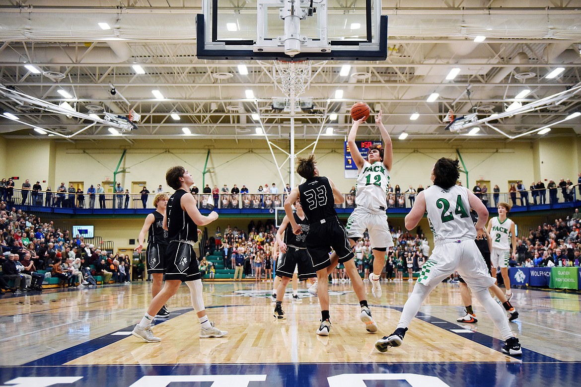 Glacier's Weston Price (12) looks to shoot against Flathead during a crosstown matchup at Glacier High School on Friday. (Casey Kreider/Daily Inter Lake)