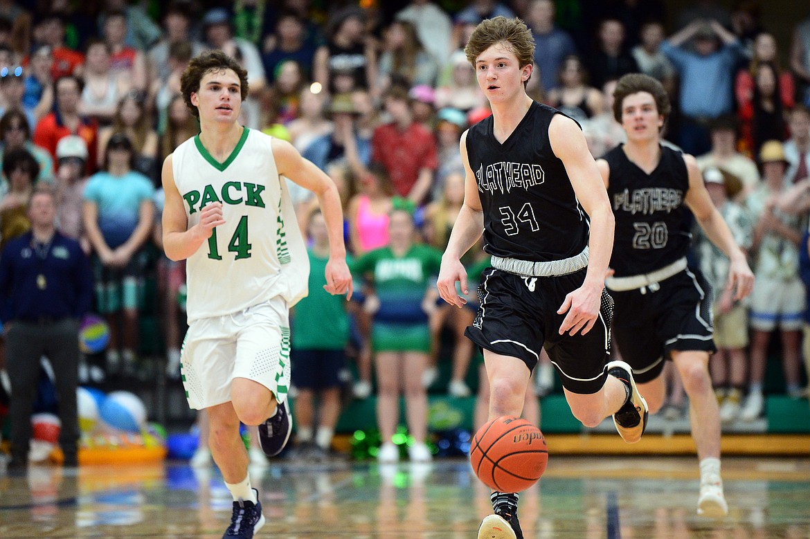 Flathead's Joston Cripe (34) brings the ball upcourt against Glacier during a crosstown matchup at Glacier High School on Friday. (Casey Kreider/Daily Inter Lake)