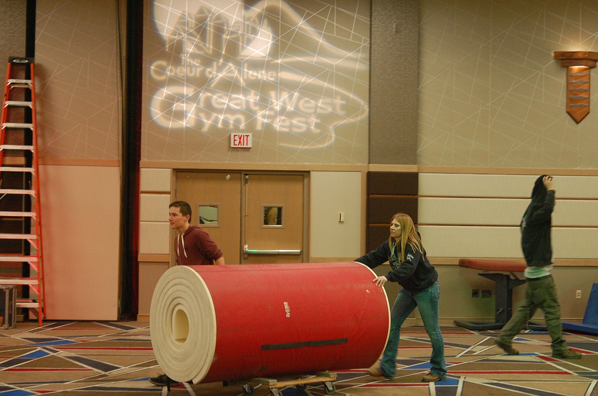 BILL BULEY/Press
Ethan Storm and Karen Traub bring in equipment for the Great West Gym Fest.