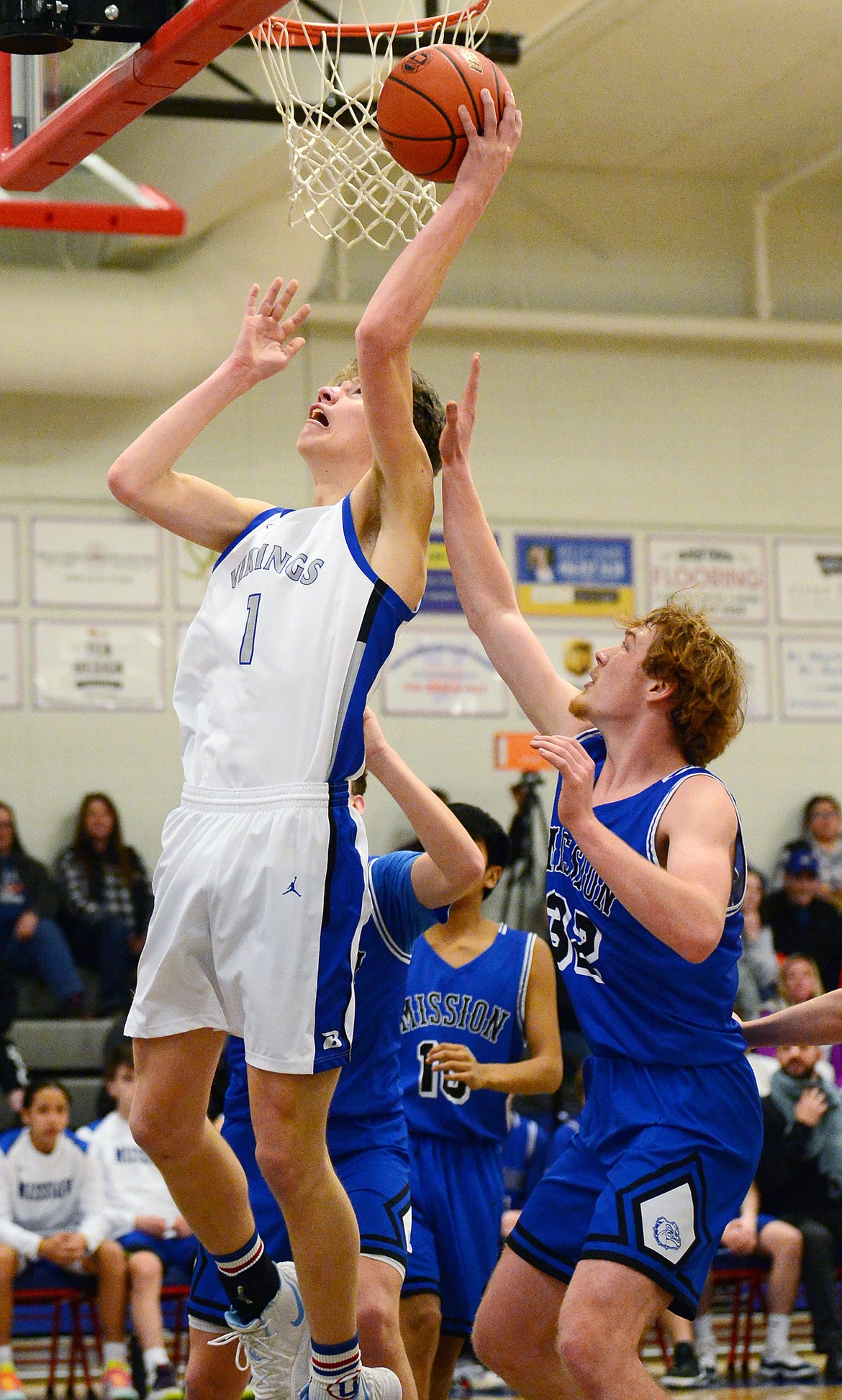 Bigfork's Colt Thorness (1) looks to shoot in front of Mission's Layne Spidel (32) at Bigfork High School on Thursday. (Casey Kreider/Daily Inter Lake)