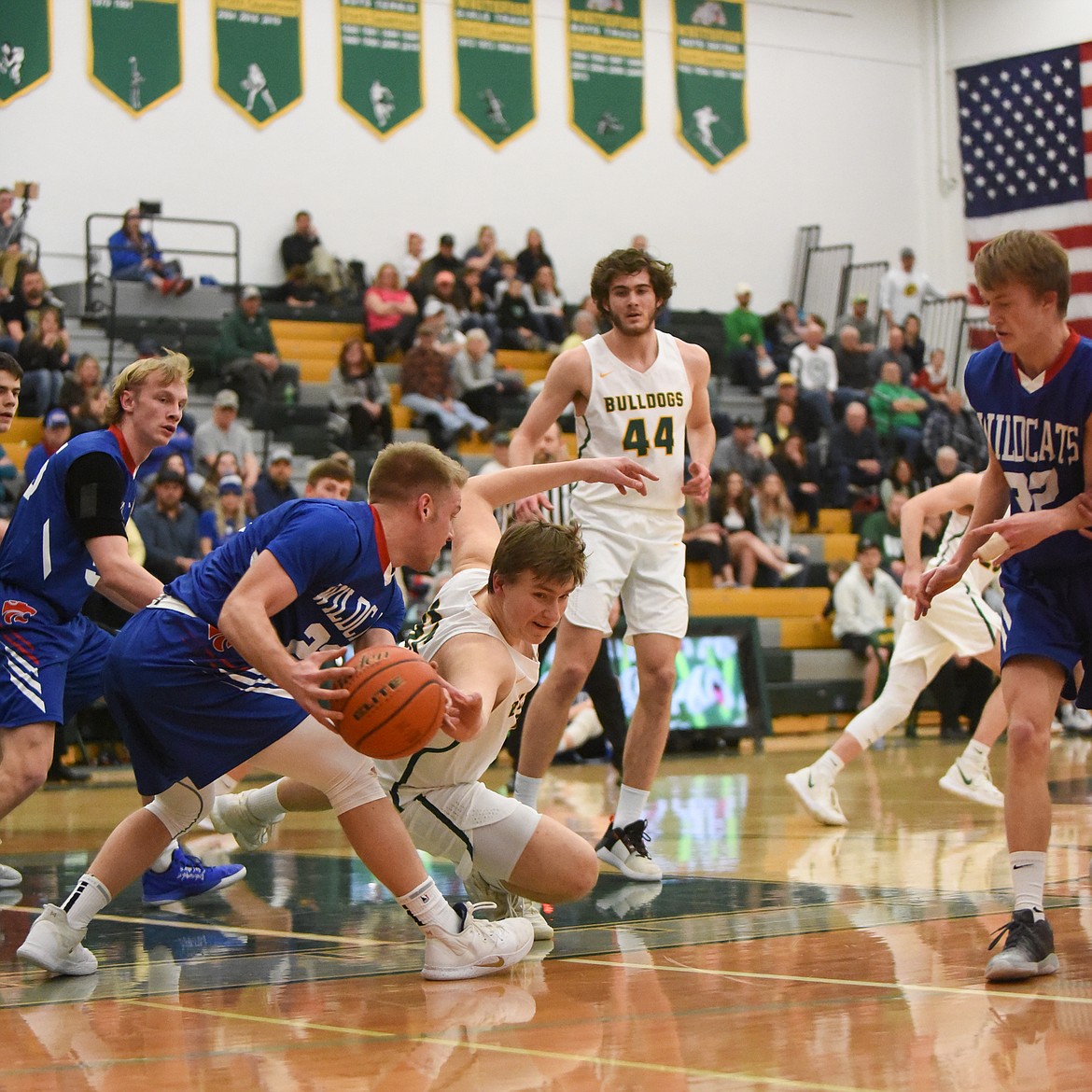 Talon Holmquist dives for the ball during the Dogs&#146; Thursday night win over Columbia Falls. (Daniel McKay/Whitefish Pilot)