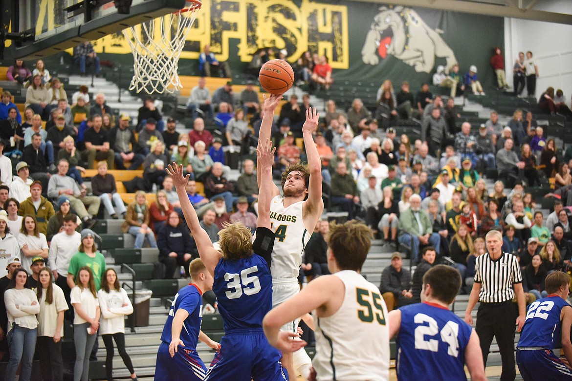 Sam Menicke puts up a floater during the Dogs&#146; Thursday night win over Columbia Falls. (Daniel McKay/Whitefish Pilot)