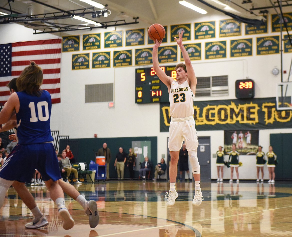 Justin Conklin launches one of his six made threes during Monday&#146;s play-in victory over Columbia Falls. (Daniel McKay/Whitefish Pilot)