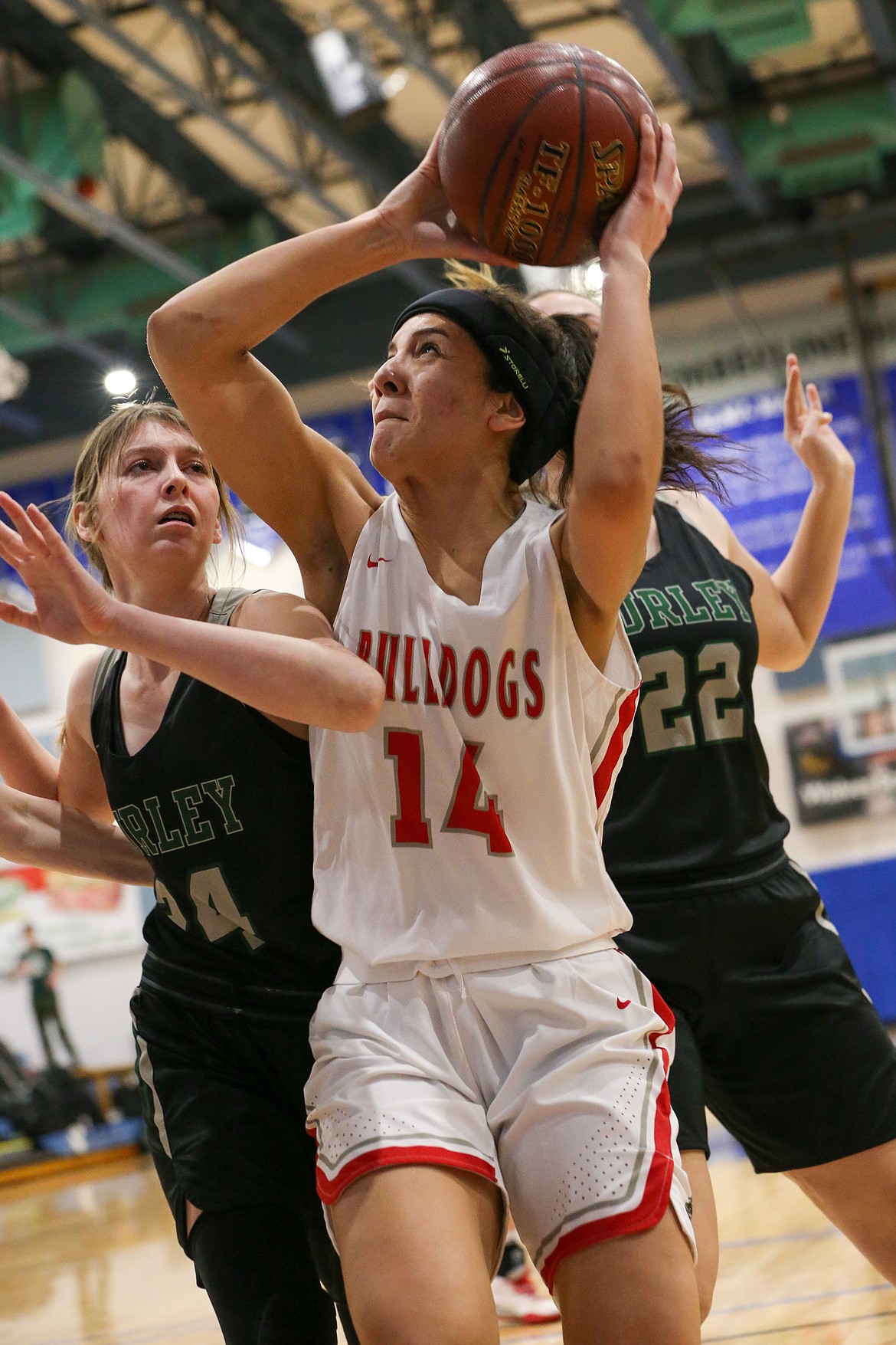 (Photo courtesy of JASON DUCHOW PHOTOGRAPHY)
Junior Bella Phillips tries to put up a shot while Burley defenders surround her Thursday night at Timberline High.