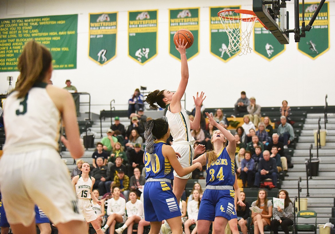 Jadi Walburn rises for the layup during Monday&#146;s play-in victory over Libby. (Daniel McKay/Whitefish Pilot)