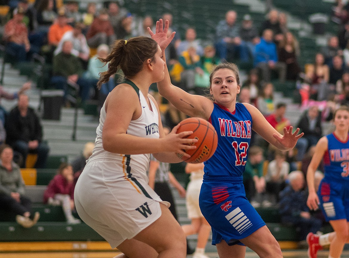 LaKia Hill presses a Whitefish player. The Kats defense held the Bulldogs to just 12 points.