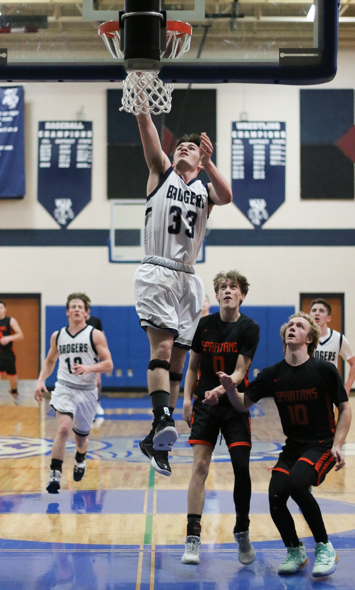 Photo by MANDI BATEMAN 
Braeden Blackmore drives to the basket.