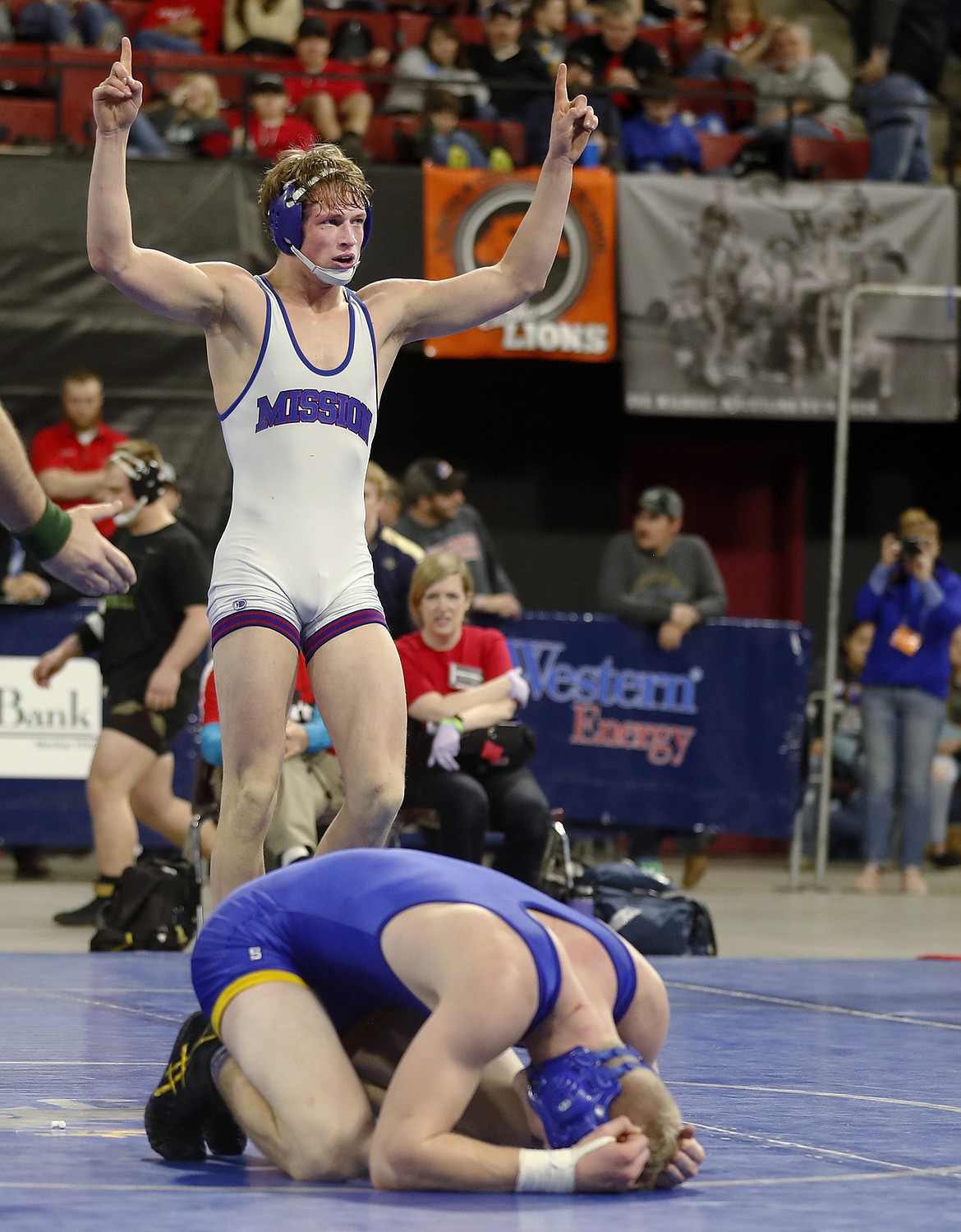 Isaiah Allik celebrates his win over Nate Gorham of Shepherd in the Class B-C 170-pound championship match at the state wrestling tournament Saturday. (Casey Page/Billings Gazette)