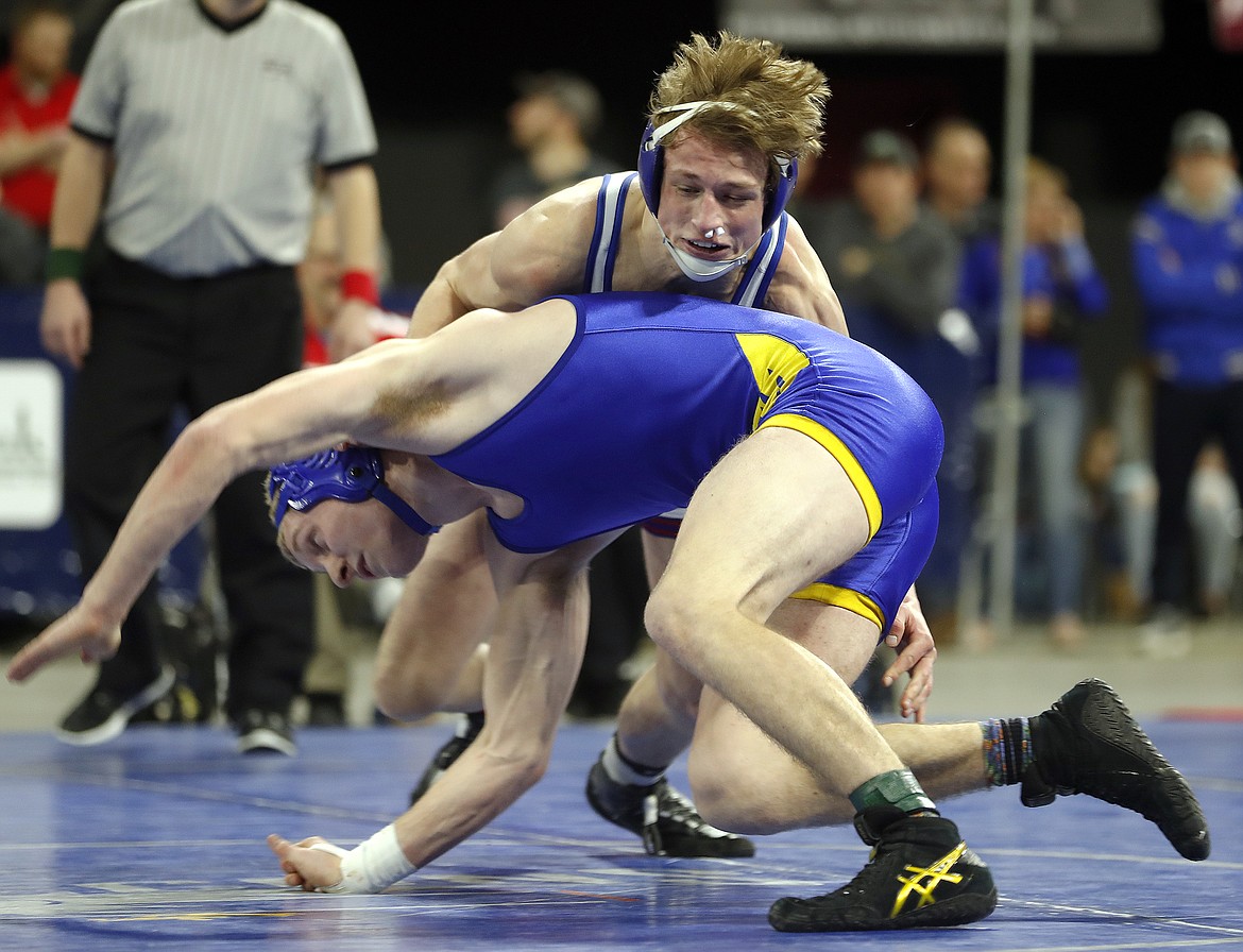 Isaiah Allik of Mission-Charlo and Nate Gorham of Shepherd wrestle in the Class B-C 170-pound championship match at the state wrestling tournament at First Interstate Arena on Saturday. (Casey Page/Billings Gazette)